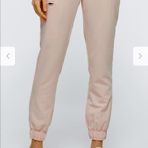 Jaanuu 5 pocket jogger scrub pants in blush pink.